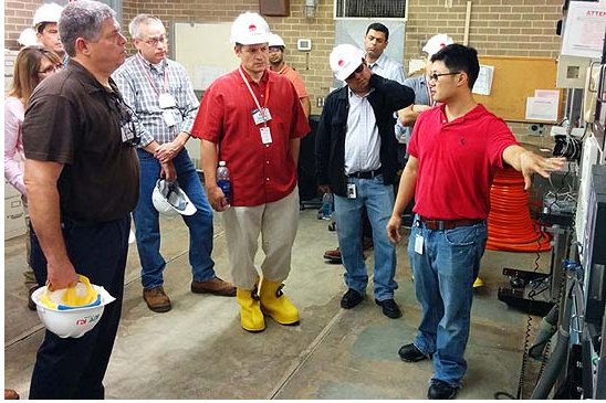 Dr. Chan Wong, senior engineer with Entergy, discusses the fiber project with leaders from other U.S. utilities during a site visit in September.